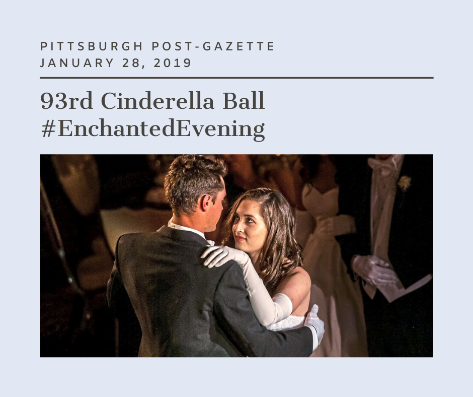 A couple dancing at their wedding in front of the pittsburgh post gazette.