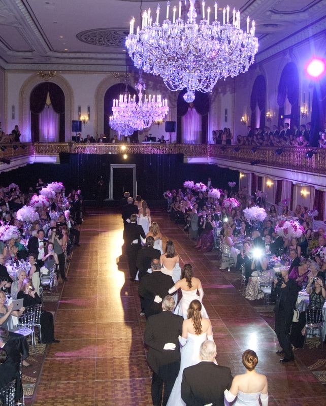 A large ballroom with many people in it