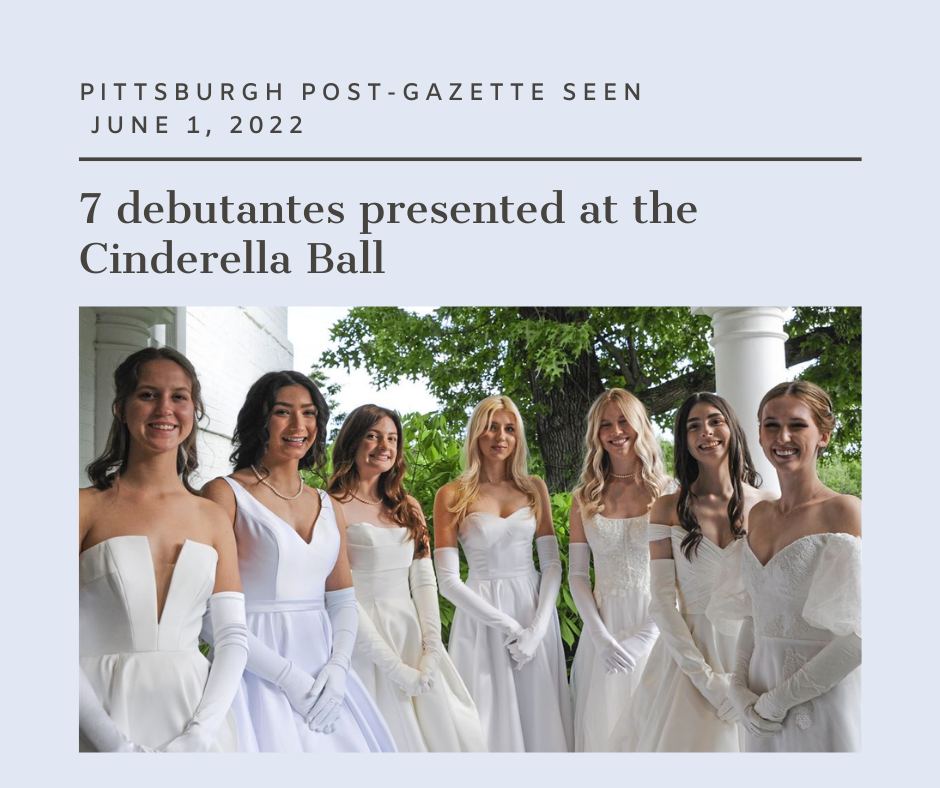 A group of women in white dresses posing for the camera.